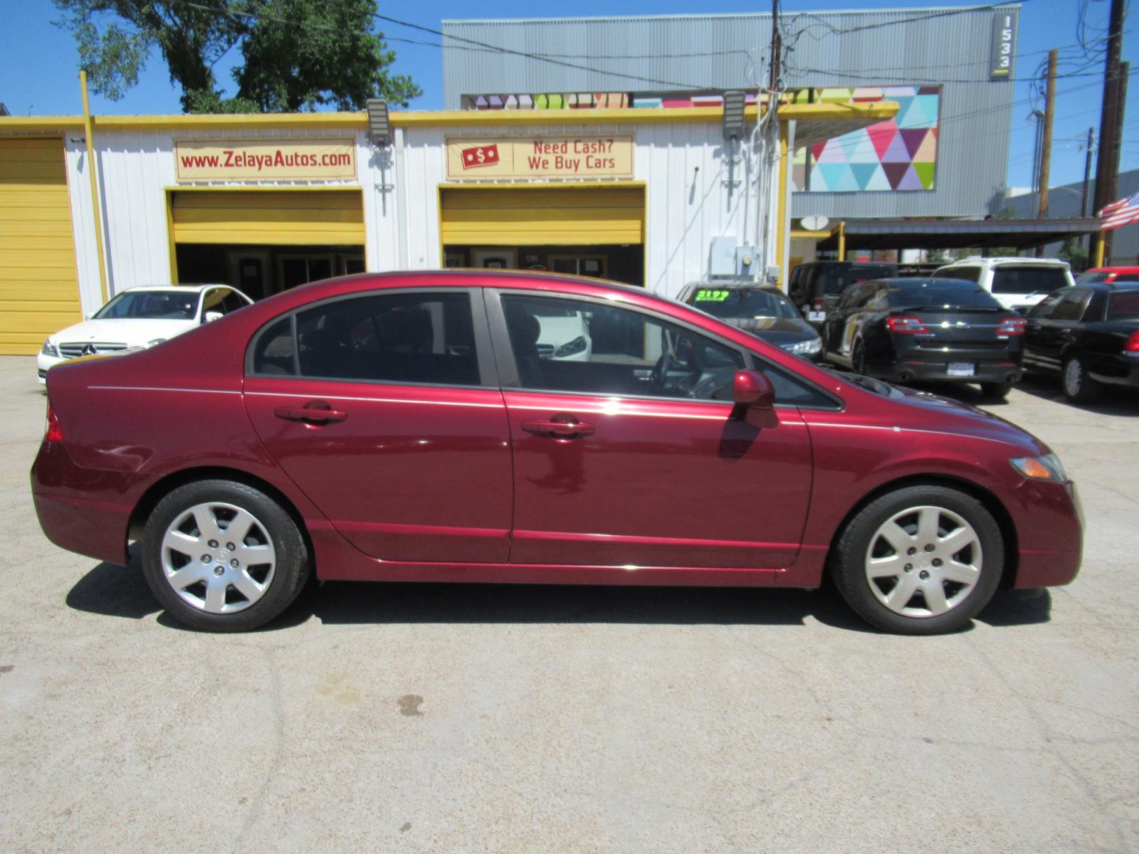 2009 Red /Tan Honda Civic LX Sedan AT (19XFA16529E) with an 1.8L L4 SOHC 16V engine, Automatic Overdrive transmission, located at 1511 North Shepherd Dr., Houston, TX, 77008, (281) 657-1221, 29.798361, -95.412560 - 2009 HONDA CIVIC LX VIN: 19XFA16529E042917 1 9 X F A 1 6 5 2 9 E 0 4 2 9 1 7 SEDAN 4 DR 1.8L I4 F SOHC 16V GASOLINE FRONT WHEEL DRIVE - Photo #0